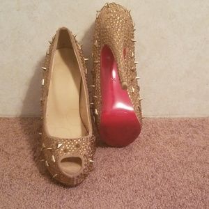 Gold heels with red bottoms